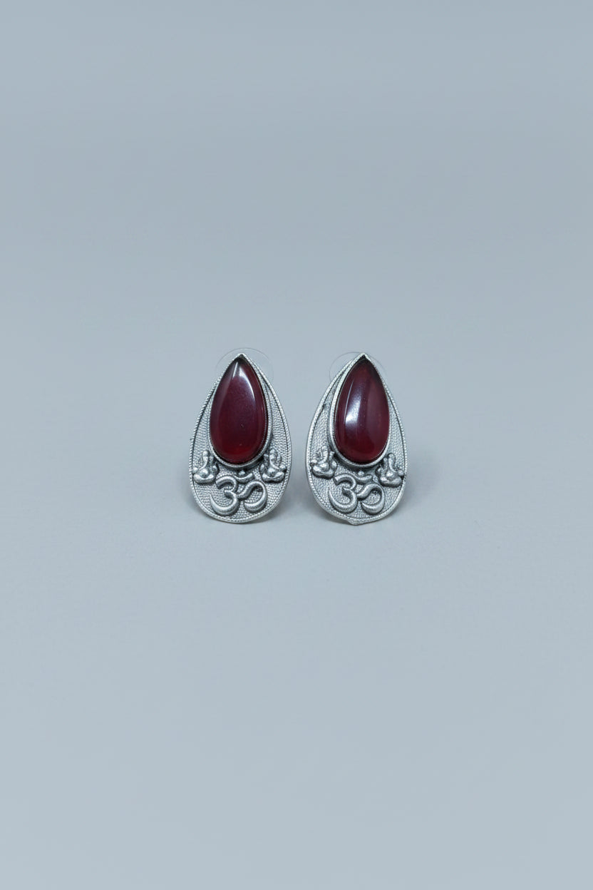 Premium oxidised silver OM teardrop stud earrings with red stone.