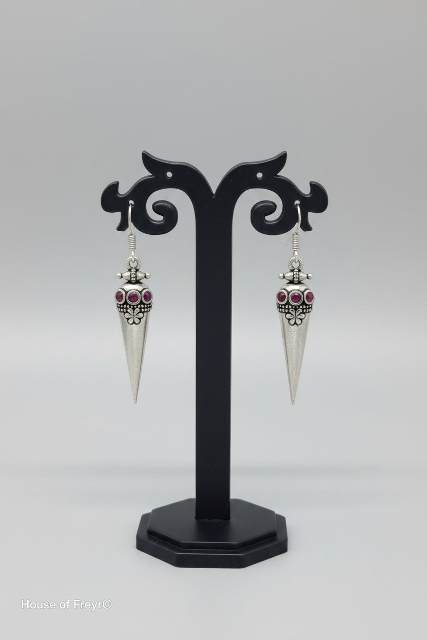 premium oxidised cone-shaped oxidized silver earrings with tribal-inspired detailing and red stone accents