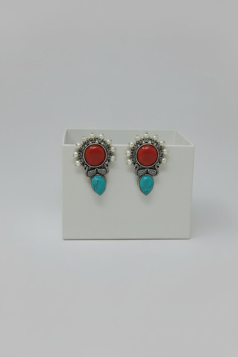 Pair of vintage oxidised stud earrings with turquoise and red stones.