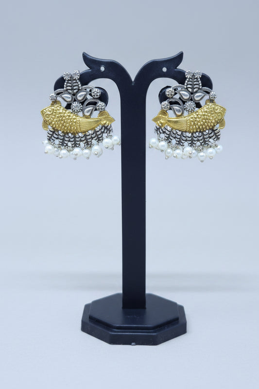 A pair of dual-toned fish motif earrings with gold-plated alloy and oxidized silver detailing, featuring a row of white pearls.