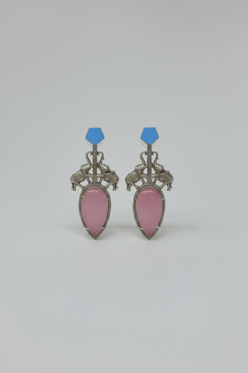 Pair of  stylish indo-western oxidised dangler earrings with bid pink stone, blue tops, and elephant motif.