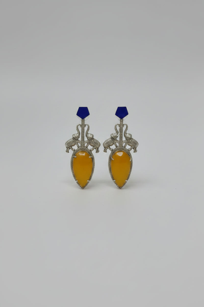 Pair of  stylish indo-western oxidised dangler earrings with bid yellow stone, blue tops, and elephant motif.