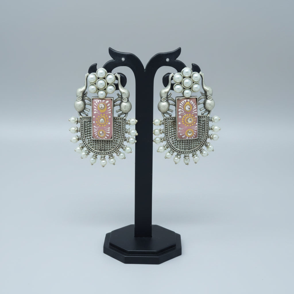 Pair of oxidised dangler with handmade Meenakari work on pink moissanite stone, with pearls and elephant motif