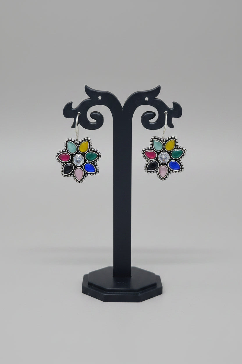 Pair of premium oxidised floral earrings with navratna moissanite gemstones