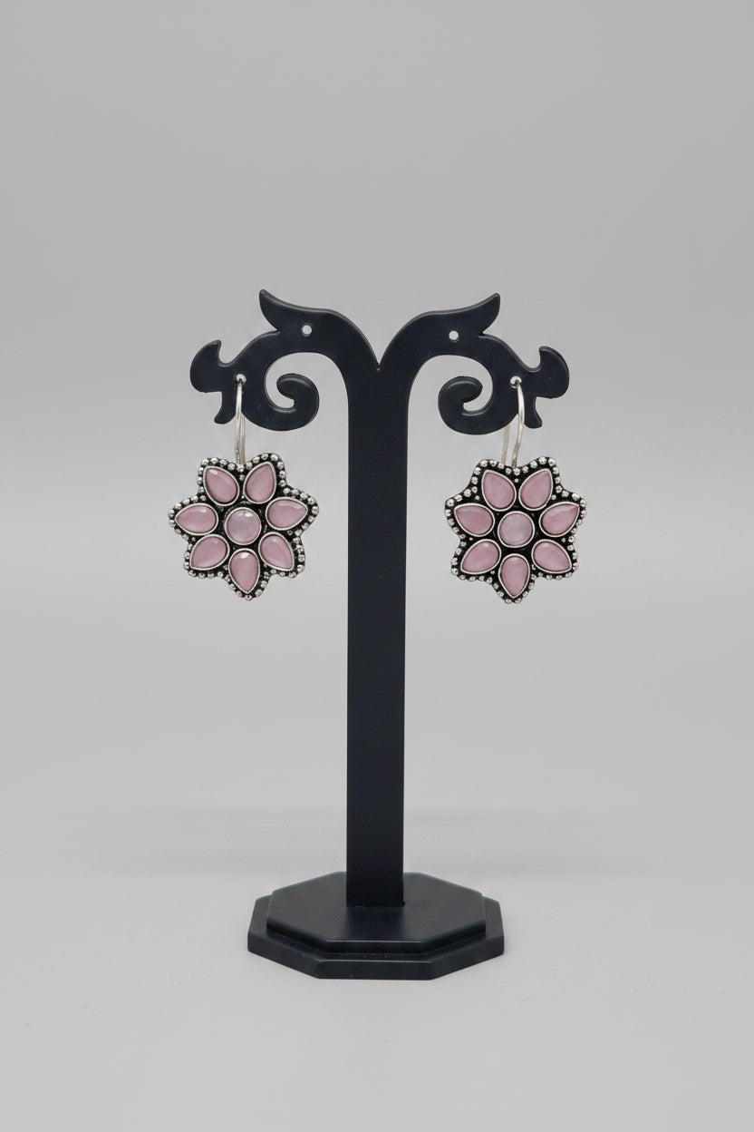 Pair of premium oxidised floral earrings with pink moissanite gemstones