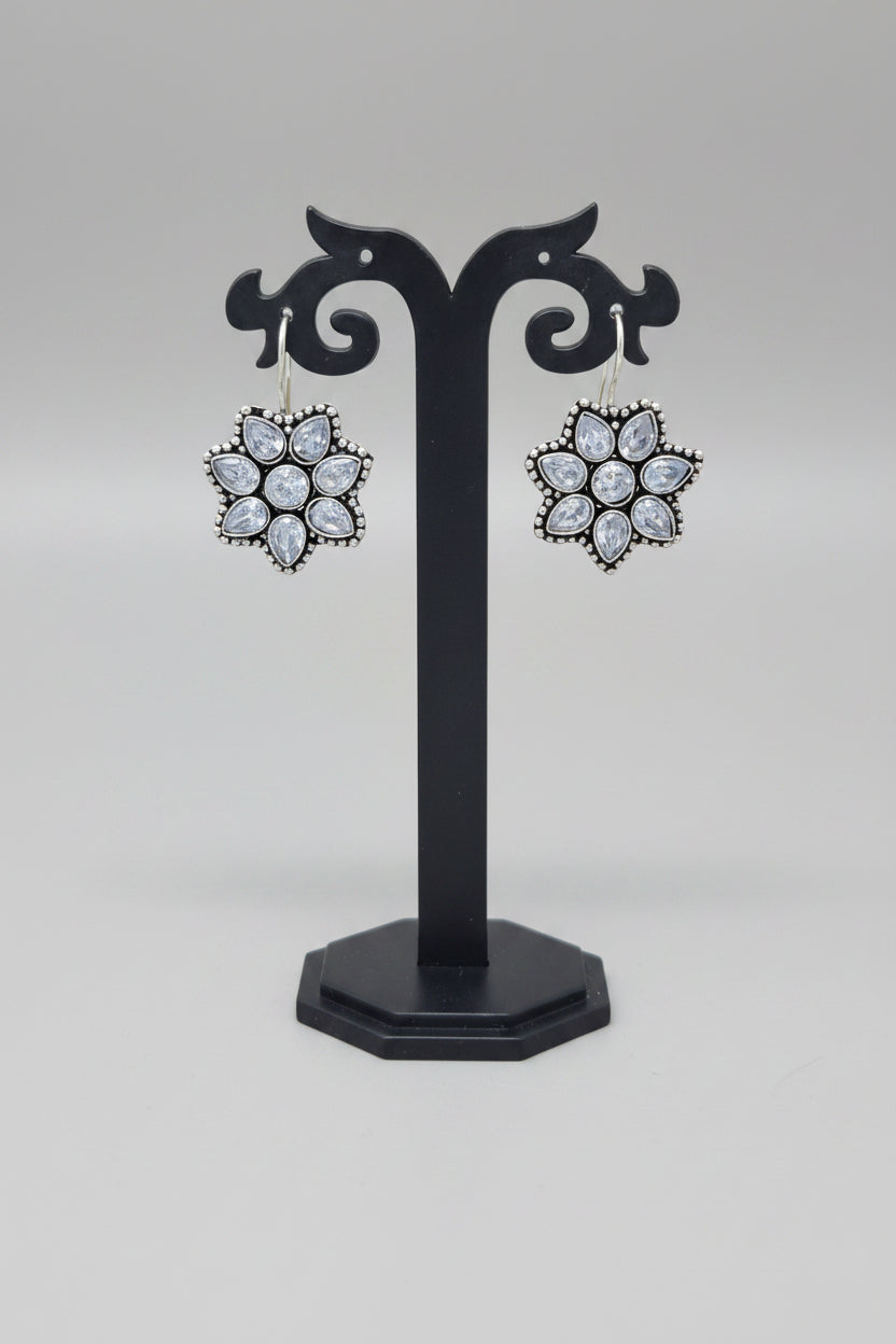 Pair of premium oxidised floral earrings with white moissanite gemstones