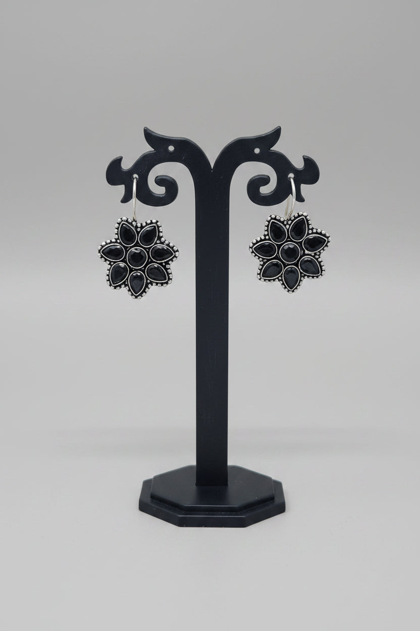 Pair of premium oxidised floral earrings with black moissanite gemstones