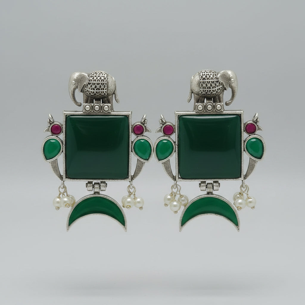 Pair of  oxidised earrings with green square stones,  green half moon stones, and silver elephant designs