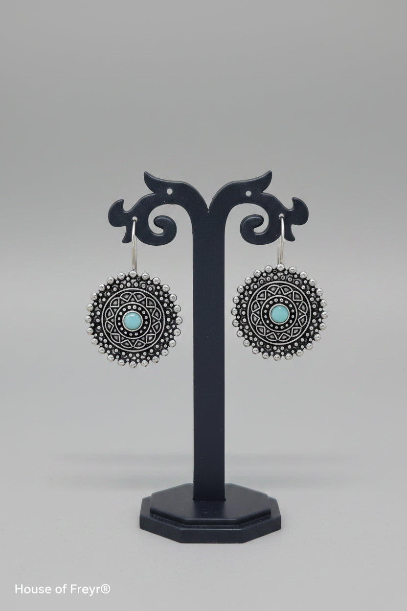 Premium oxidised mandala-inspired oxidized silver earrings with a central mint semi-precious stone.