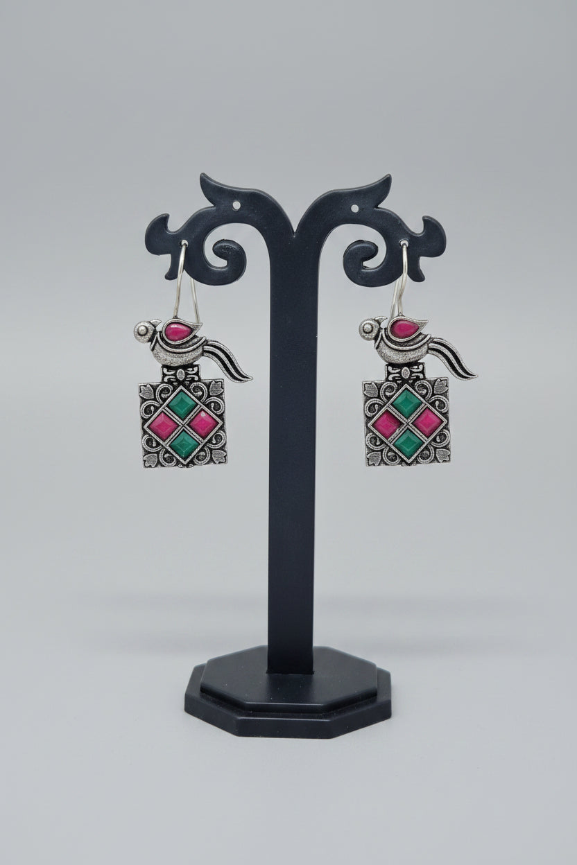 a pair of vintage oxidised bird motif drop earring with multicolor gemstones