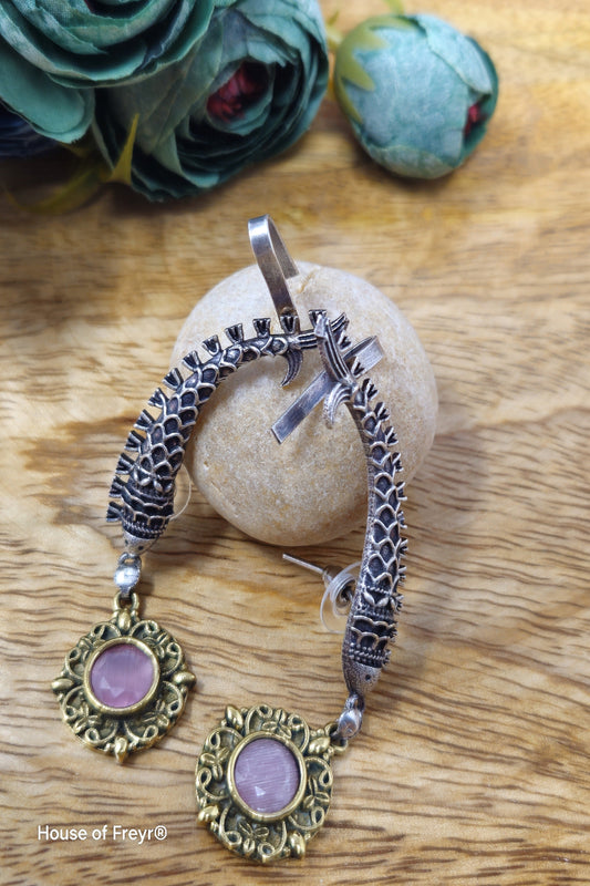 Antique oxidised silver ear cuffs with pink semi-precious stone accents and intricate fish motif carvings.