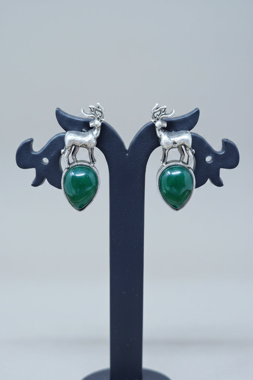 premium oxidised stud earrings featuring silver deer motifs on top of green teardrop-shaped semi-precious 