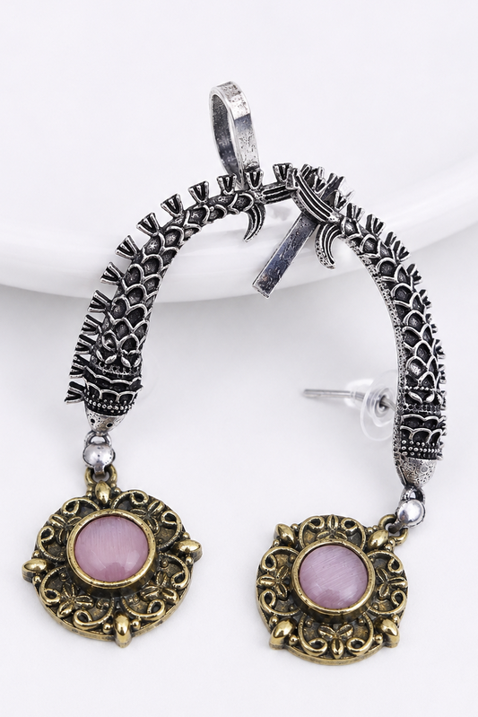 Antique oxidised silver ear cuffs with pink semi-precious stone accents and intricate fish motif carvings.