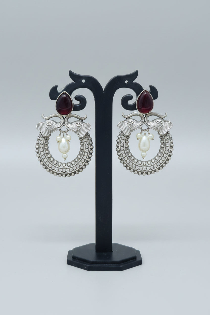 Pair of oxidised Chandbali earrings with red stones and pearls and elephant motif