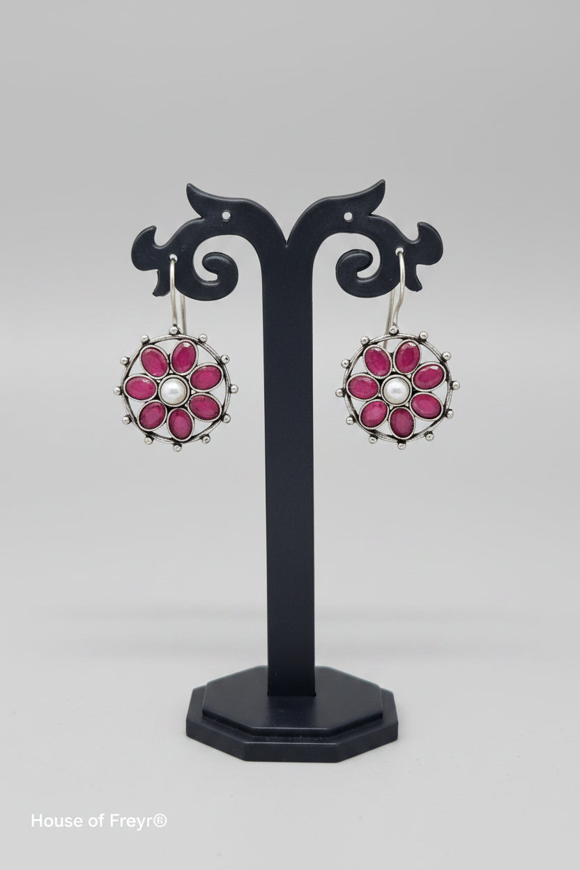 pair of Oxidised Floral drop earring in floral pattern with pearl and red gemstones