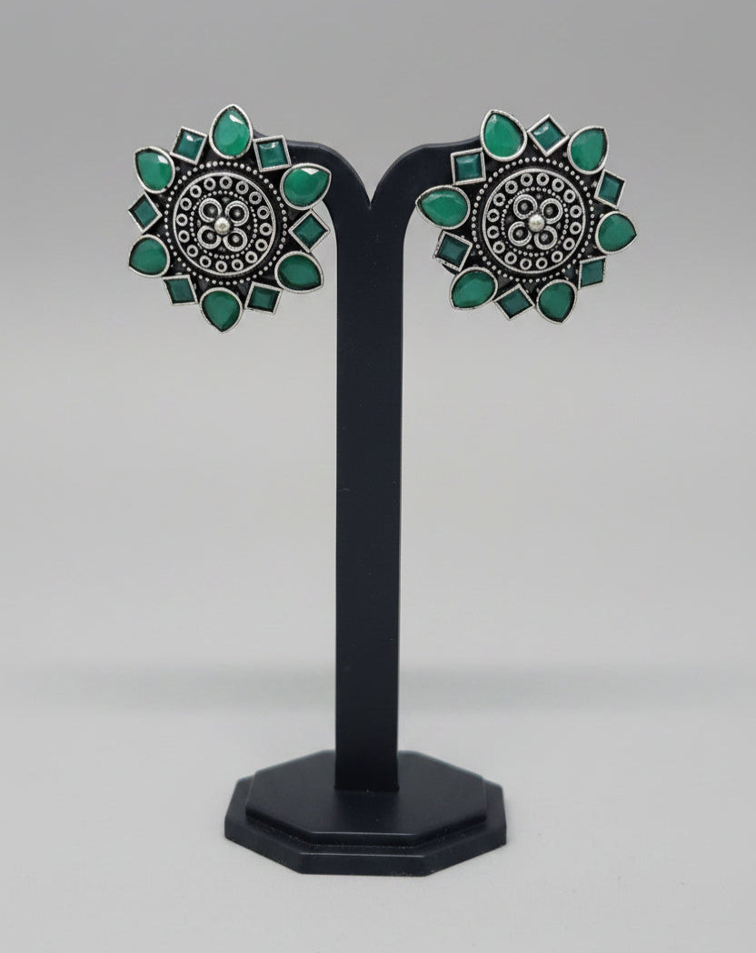 Pair of premium oxidised floral stud earrings with green gemstone