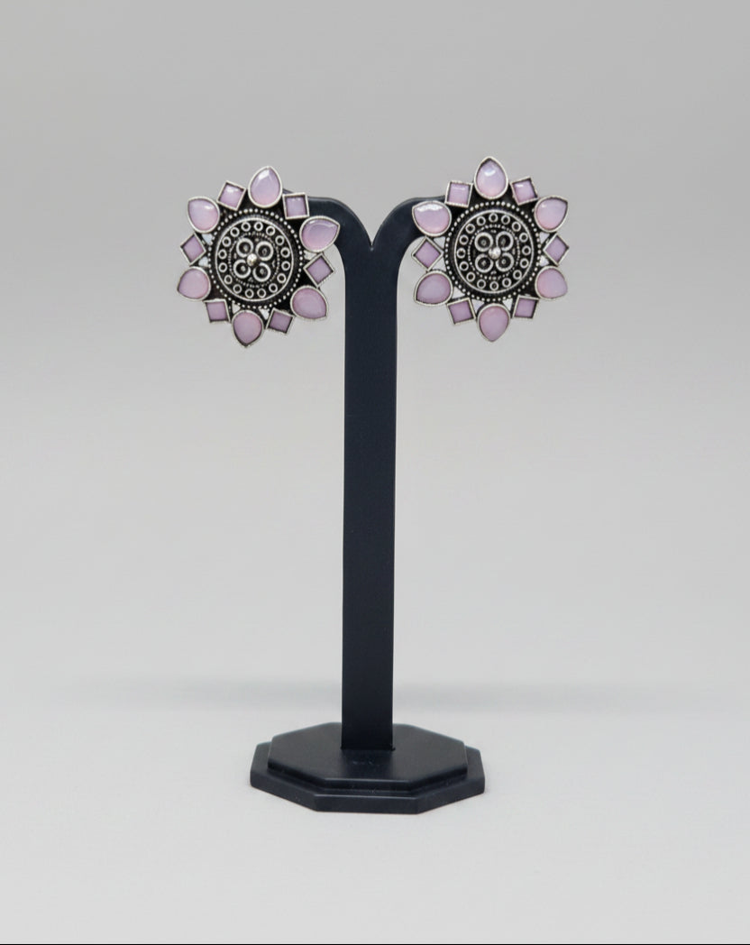 Pair of oxidised floral stud earrings with pink gemstone