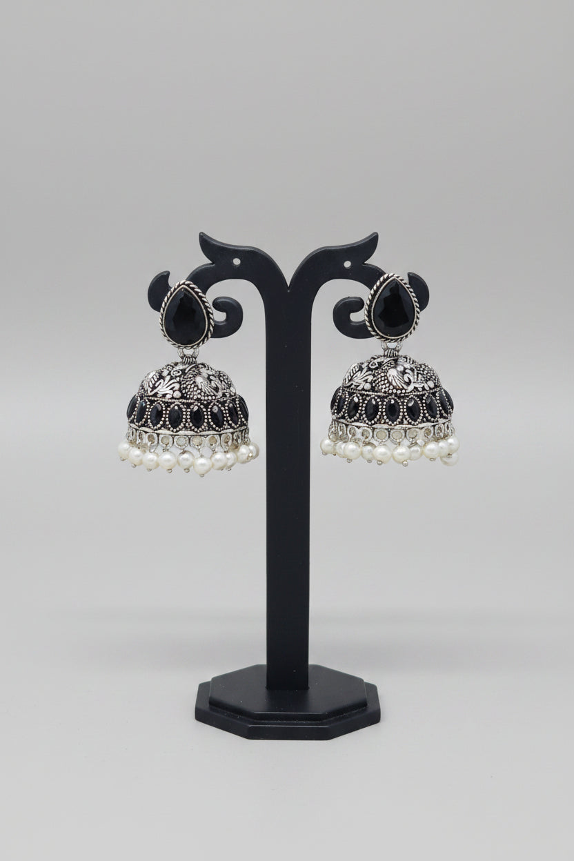Pair of silver oxidised jhumki earrings with pearls and black moissanite stone