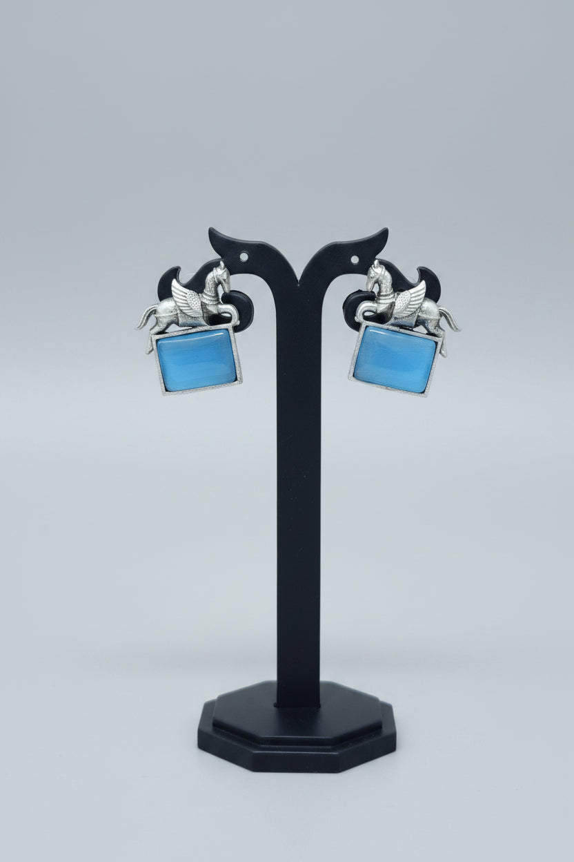 oxidised lucky horse earring with blue gemstone