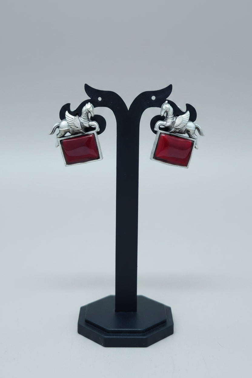 oxidised lucky horse earring with red gemstone