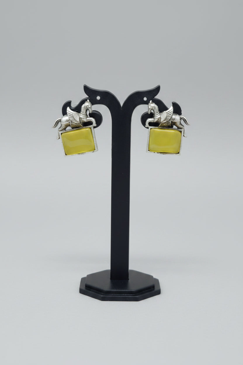 oxidised lucky horse earring with yellow gemstone