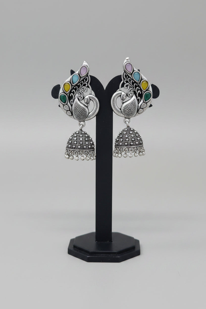 Pair of oxidised silver jhumka earrings, peacock motif with colorful/multicolor gemstones.