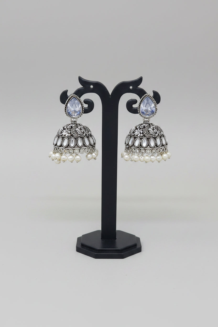 Pair of silver oxidised jhumki earrings with pearls and white moissanite stone