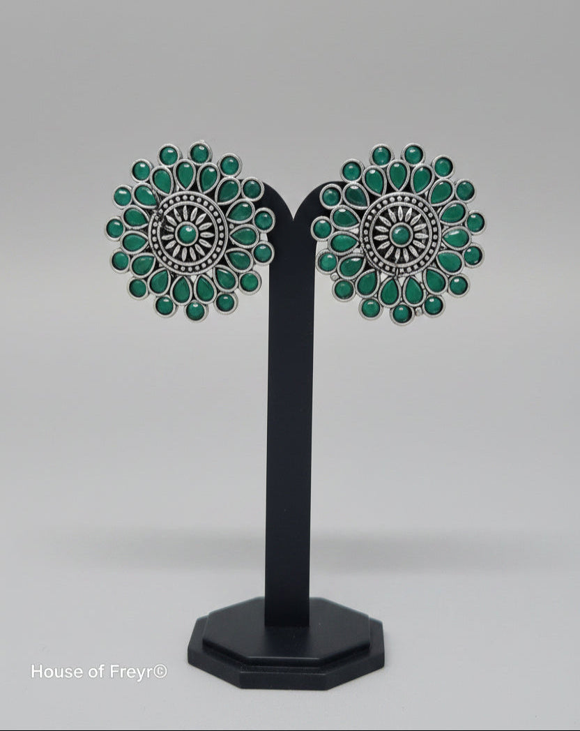 Antique oxidised Silver Sunburst Stud Earrings with intricate oxidized silver work, green semi-precious stones in a teardrop and circular setting.