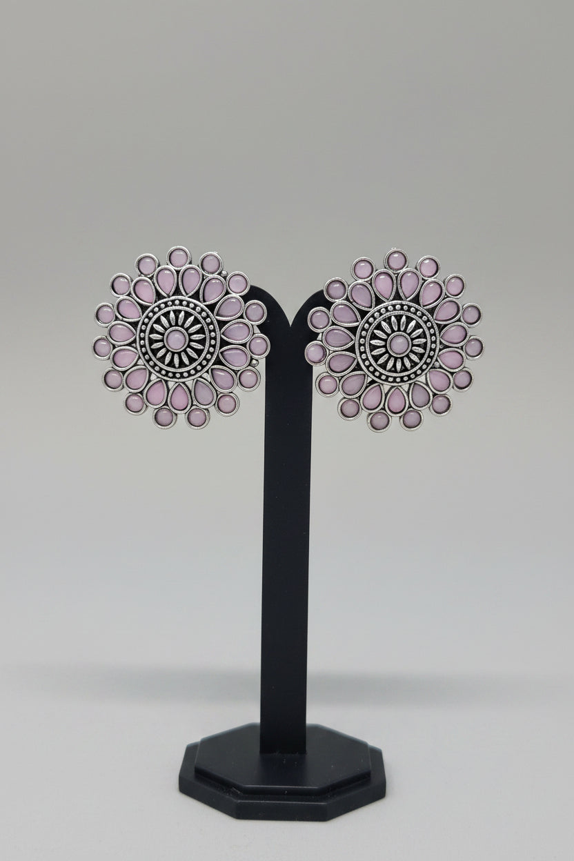 Antique oxidised Silver Sunburst Stud Earrings with intricate oxidized silver work, pink semi-precious stones in a teardrop and circular setting.