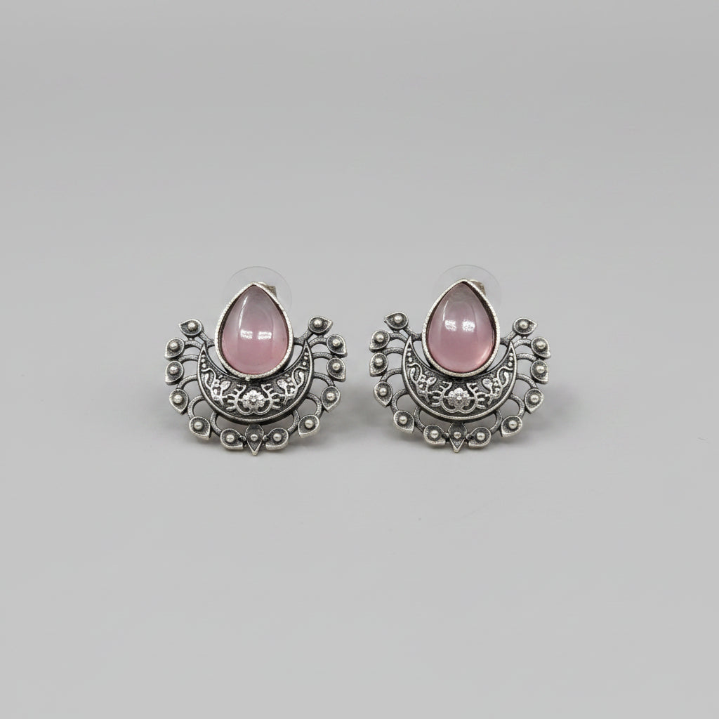 Oxidised silver stud earrings with teardrop pink gemstones.