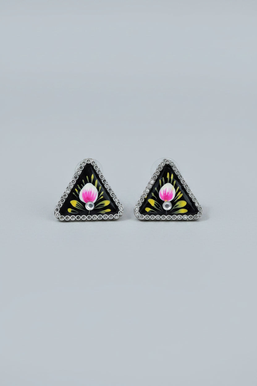 Handmade meenakari design, triangular stud earrings with floral design on a gray background