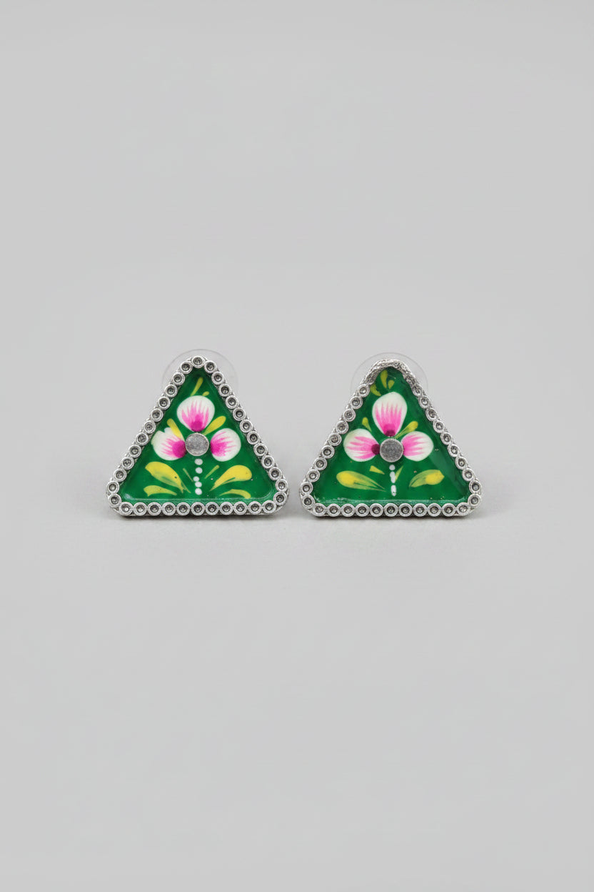 Handmade meenakari design, triangular stud earrings with green floral design on a gray background