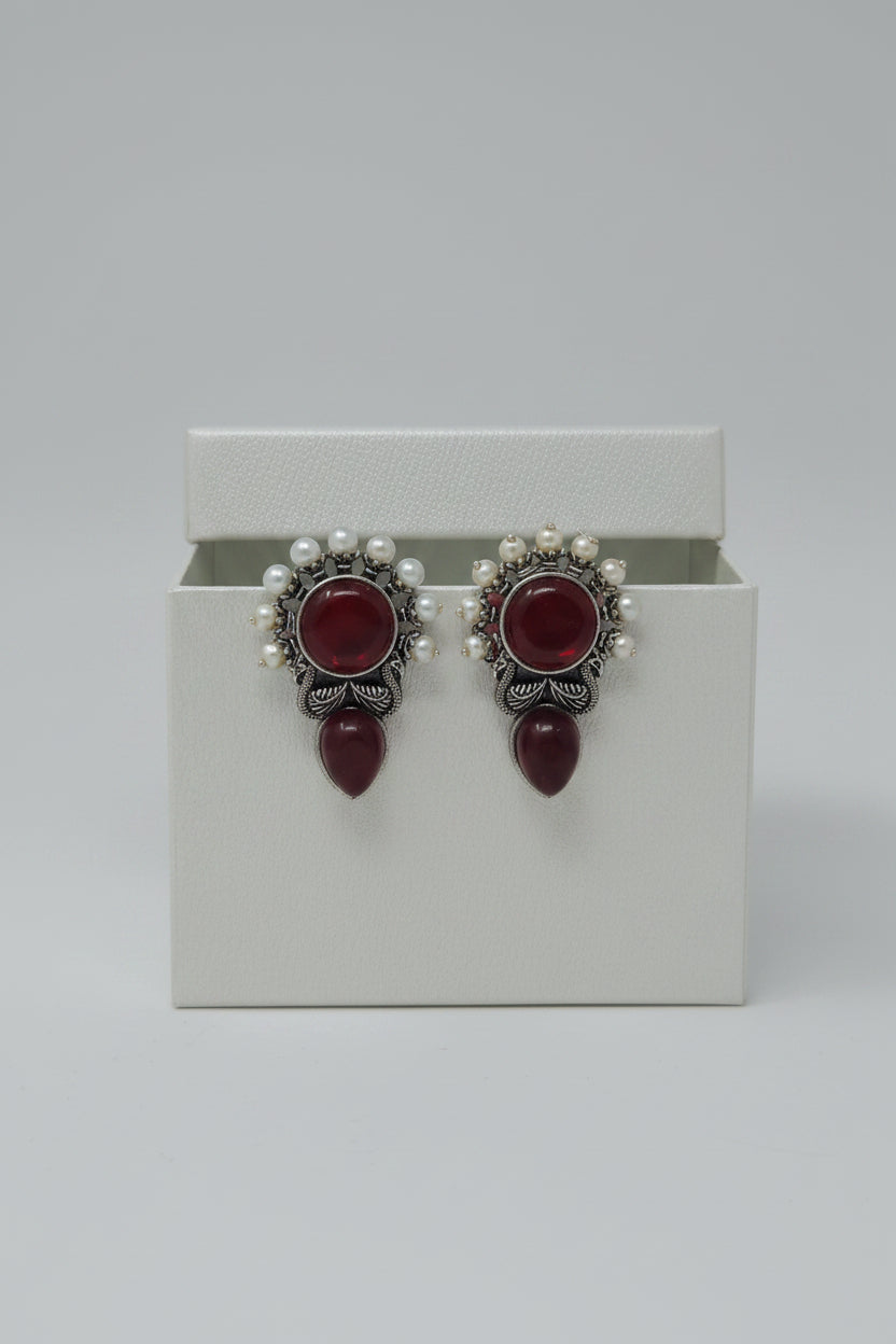 Pair of vintage oxidised stud earrings with maroon stones